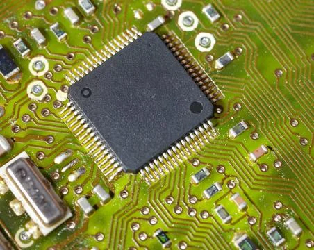 Close-up of a green electronic computer board with microchips Stock Photos