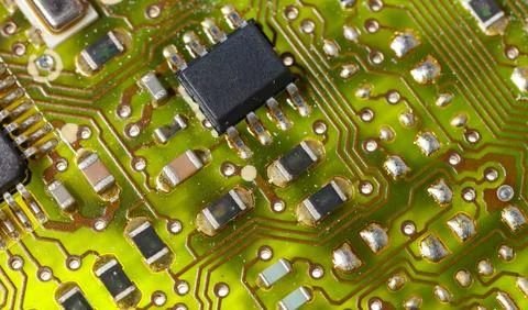 Close-up of a green electronic computer board with microchips Stock Photos