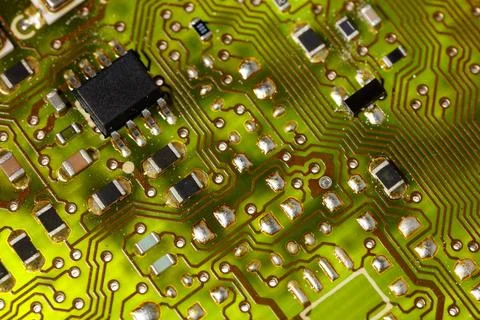 Close-up of a green electronic computer board with microchips Stock Photos