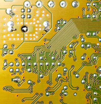 Close up of green electronic computer circuit board as background Stock Photos