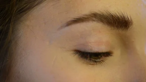 Close up green eye eyebrow of model makeup indoors Stock Footage 74152895