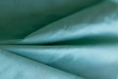 Close-up of green fabric emphasizing texture and folds Stock Photos