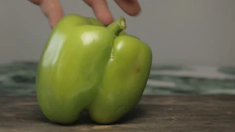 Close up of green fresh bell pepper cut in slices Stock Footage