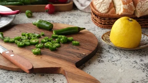 Close-up of a green hot pepper cut on a beautifully wooden cutting board. Stock Footage 236608521