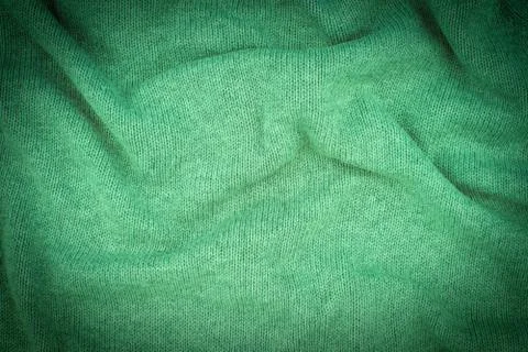 Close up green knitted pullover background. Stock Photos