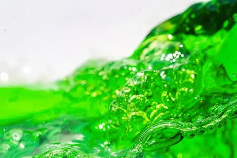 Close-up of green liquid bubbling in a clear container Stock Photos