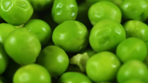 Close Up Green Peas Background Rotating. Macro Shot Fresh Organic Green Peas. Video stock 148274640