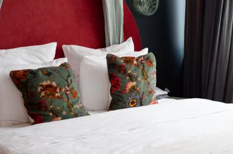 Close up green pillows on the red bed Stock Photos