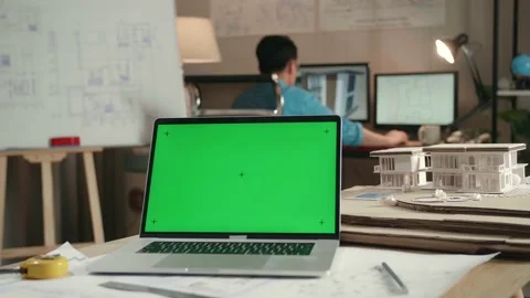 Close Up Of Green Screen Laptop In Front Of A Man Engineer Working With Desktop Stock Footage 184895217