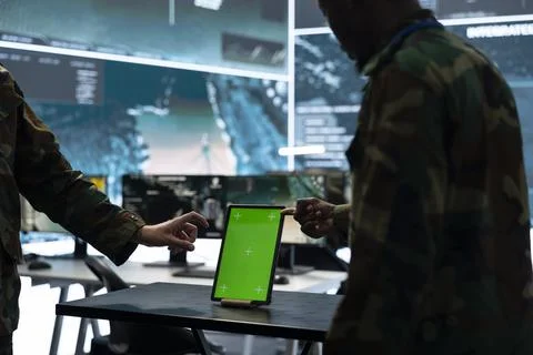 Close up of green screen mockup tablet used by army officers Stock Photos