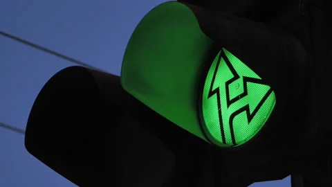 Close-up of a green traffic light indicating the direction of travel. Traffic Stock-Footage 141539449