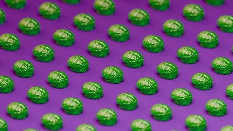Close-up green translucent brains repeated in pattern with purple background. Stock Photos