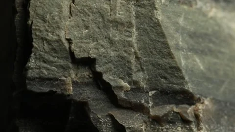 Close-Up of Greenish Rock Surface with Natural Cracks Stock Footage 287876233