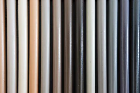 Close-up of grey and beige colored pencils neatly lined up in pencil case, .. 스톡 사진