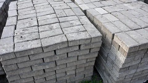 Close up of grey concrete paving bricks in a stack Stock Footage 331583586