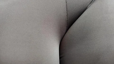 A close up of a grey fabric with a pattern that looks like a woman's butt Stock Photos