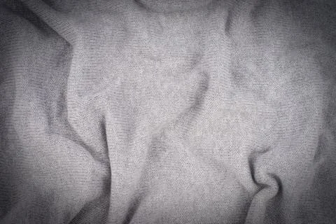 Close up grey knitted pullover background. Stock Photos