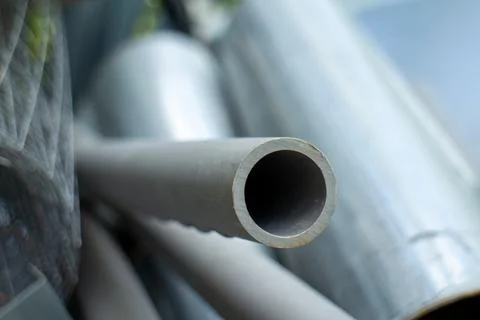 Close-up of a grey PVC pipe end in a recycling or construction yard Stock Photos