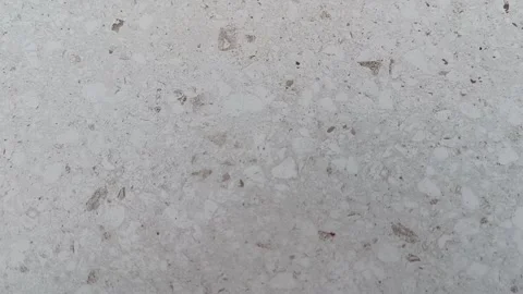 Close up of a grey speckled terrazzo surface. Suitable for backgrounds in interi 스톡 동영상 335065132