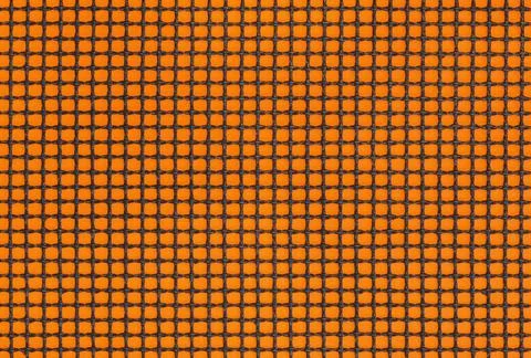 Close up of grill mat grid texture. Black mesh on the orange poster board 写真素材