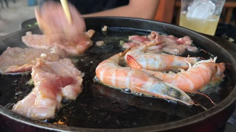 Close up grill pork, meat and fresh shrimp in hot pan. Stock Footage 86643652