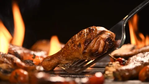 Close up grill roast bbq chicken leg on the flaming grill , 4k Stock Footage 125411907