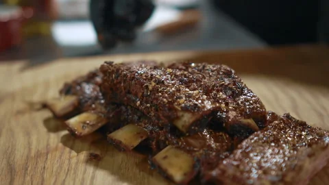 Close up of grilled beef ribs are being served at the kitchen of restaurant Stock Footage 90615655