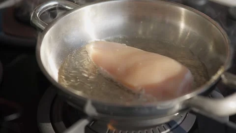 Close Up of Grilled Chicken Breast Cooking in Hot Pan Stock Footage 336466834