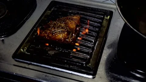 Close-up of Grilled Meat Cooking on a Kitchen Stovetop Stock Footage 315020901