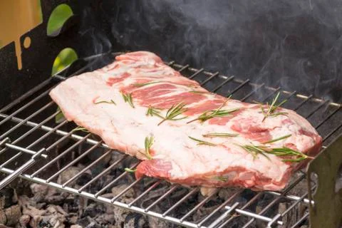 Close up of grilled meat while cooking Stock Photos
