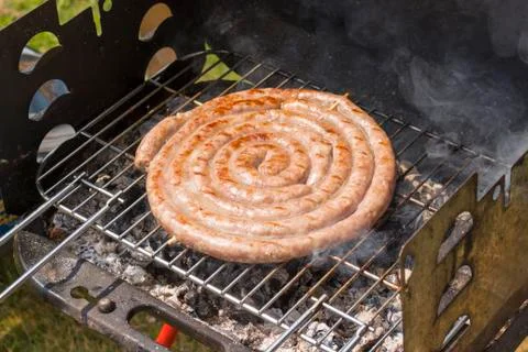 Close up of grilled meat while cooking Foto stock