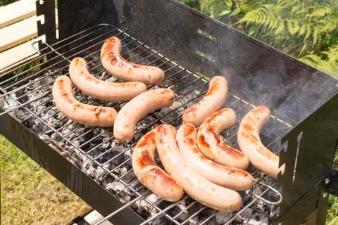Close up of grilled meat while cooking Stock Photos
