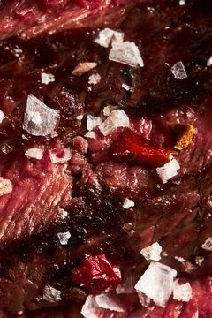 Close up of grilled Medium Rare Ribeye steak with salt cristals Stock Photos