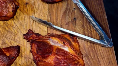 Close Up of Grilled Pork Steak on Rustic Wooden Board at Street Food Market Stock Footage 337227425