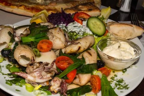 Close-up of grilled squid. Stock Photos