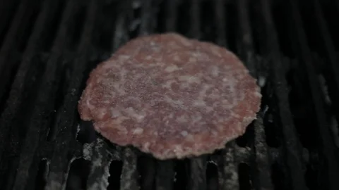 Close Up of Grilling Raw Meat Burger Stock Footage 128462792