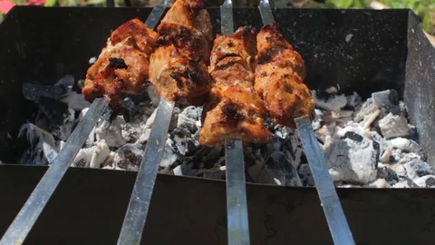 Close up grilling tasty meat barbeque on skewers. Preparing pork bbq Stock Footage 79515544