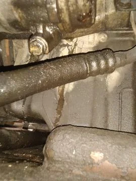 Close-up of Grimy Automotive Engine Components with Oily Residue  Fotos Stock