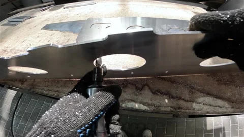 Close-up of grinding and processing of an aluminum part. Shipyard, processing of Stockbeeldmateriaal 336094892