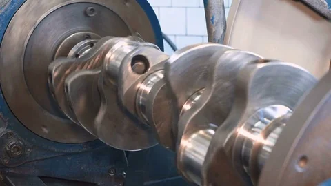 Close up of grinding of crankshaft on a grinding machine. Stock Footage 81539905