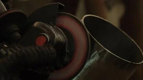 Close-up of grinding a metal pipe with a circular saw. Close-up, slow motion. Stock Footage 260623522