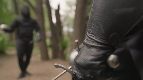 Close up grip closeup gloved hand holding fencing sword with metal pommel during Stock Footage 345083286