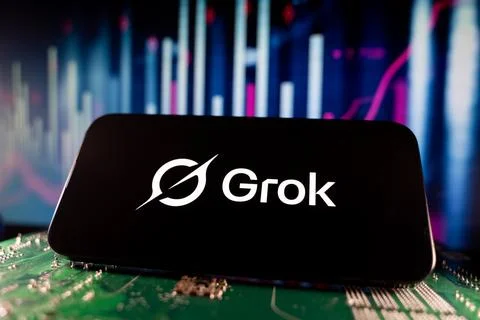 Close up of Grok logo on smartphone screen with technology and financial chart Stock Photos