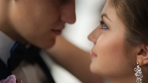 Close up groom and bride looking on each other and smiling. Just married Slow Stock Footage 73781918