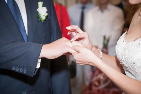 Close up Groom Put the Wedding Ring on bride Stock Photos