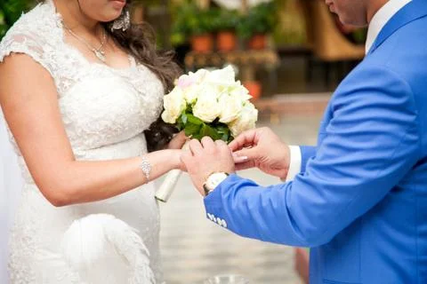 Close up Groom Put the Wedding Ring on bride Stock Photos