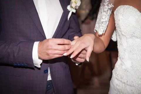 Close up Groom Put the Wedding Ring on bride Stock Photos