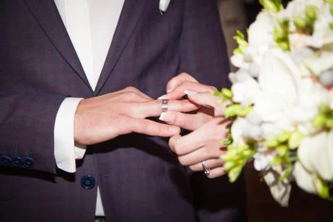 Close up Groom Put the Wedding Ring on bride Stock Photos