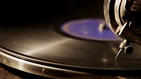Close up of grooves on a spinning vinyl record Stock Footage 329559341