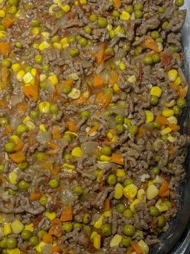 A Close-up of Ground Beef with Corn, Peas &amp; Onions for Shepherds Pie Stock Photos